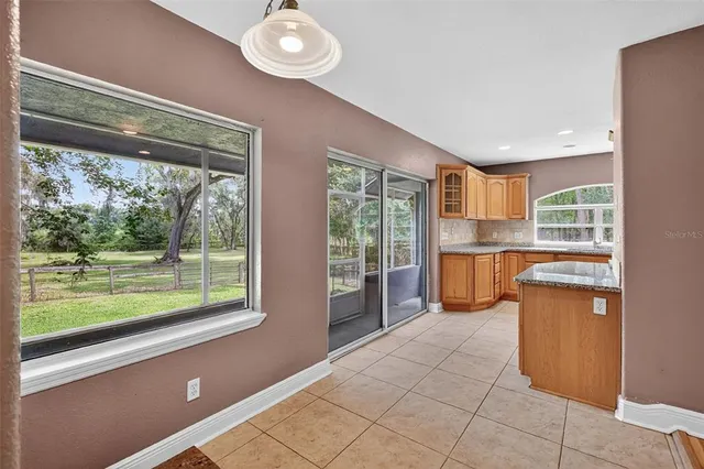 a kitchen with a stove a sink and a microwave