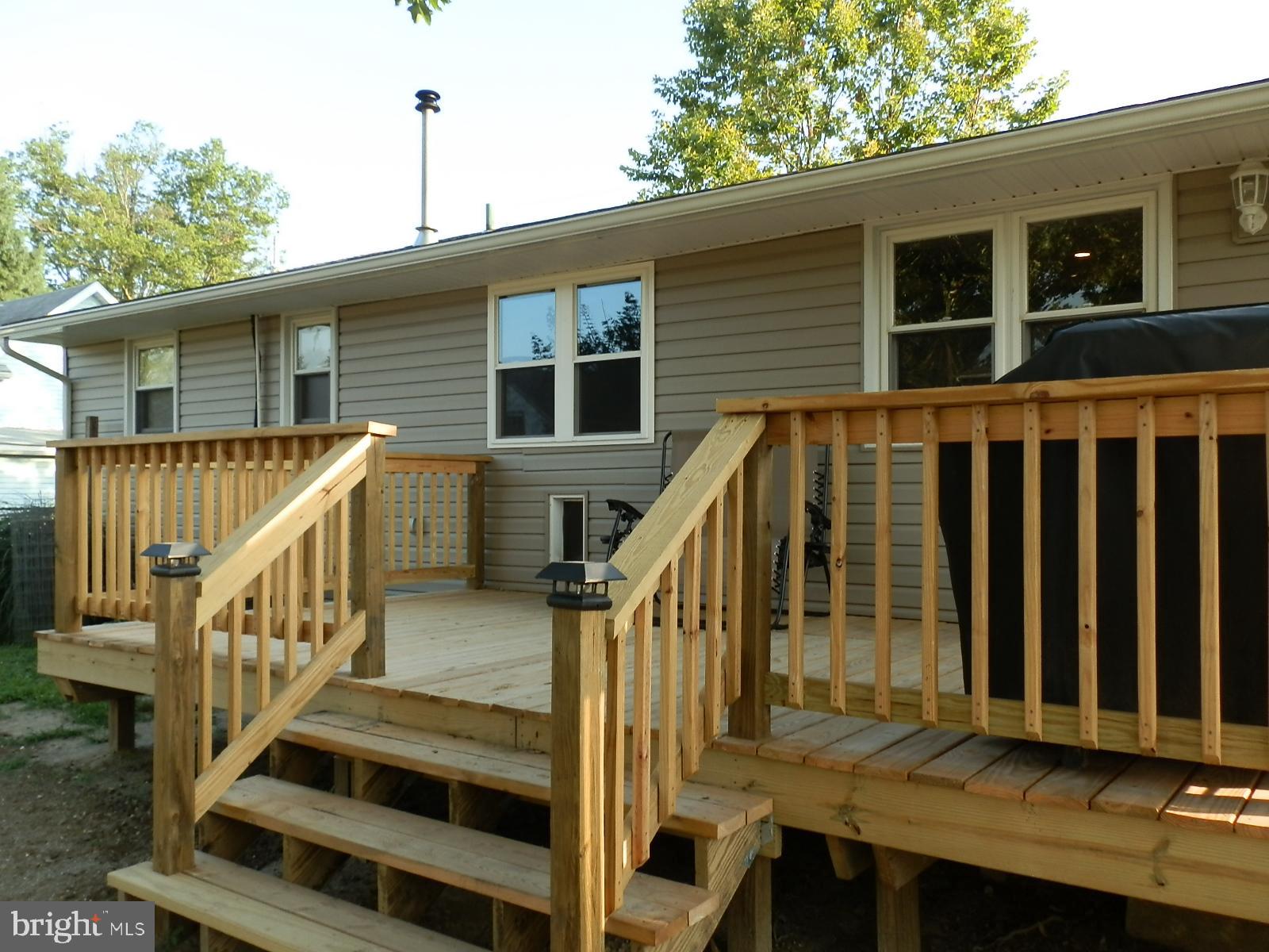 10 Georgia Road Pennsville, NJ 08070 - Photo 24 of 48 a view of deck with large windows and wooden fence