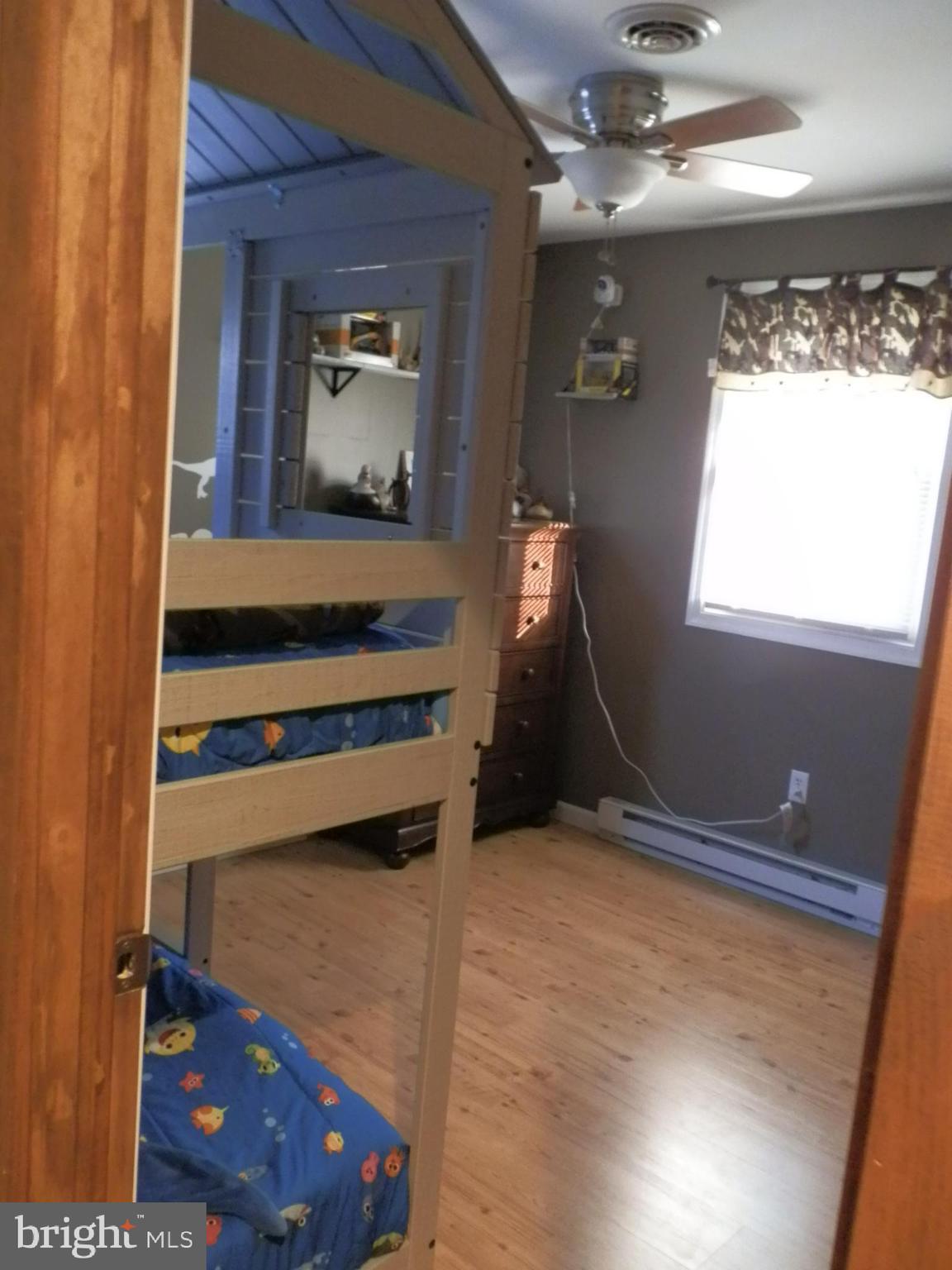 10 Georgia Road Pennsville, NJ 08070 - Photo 33 of 48 a bedroom with a bed and a window
