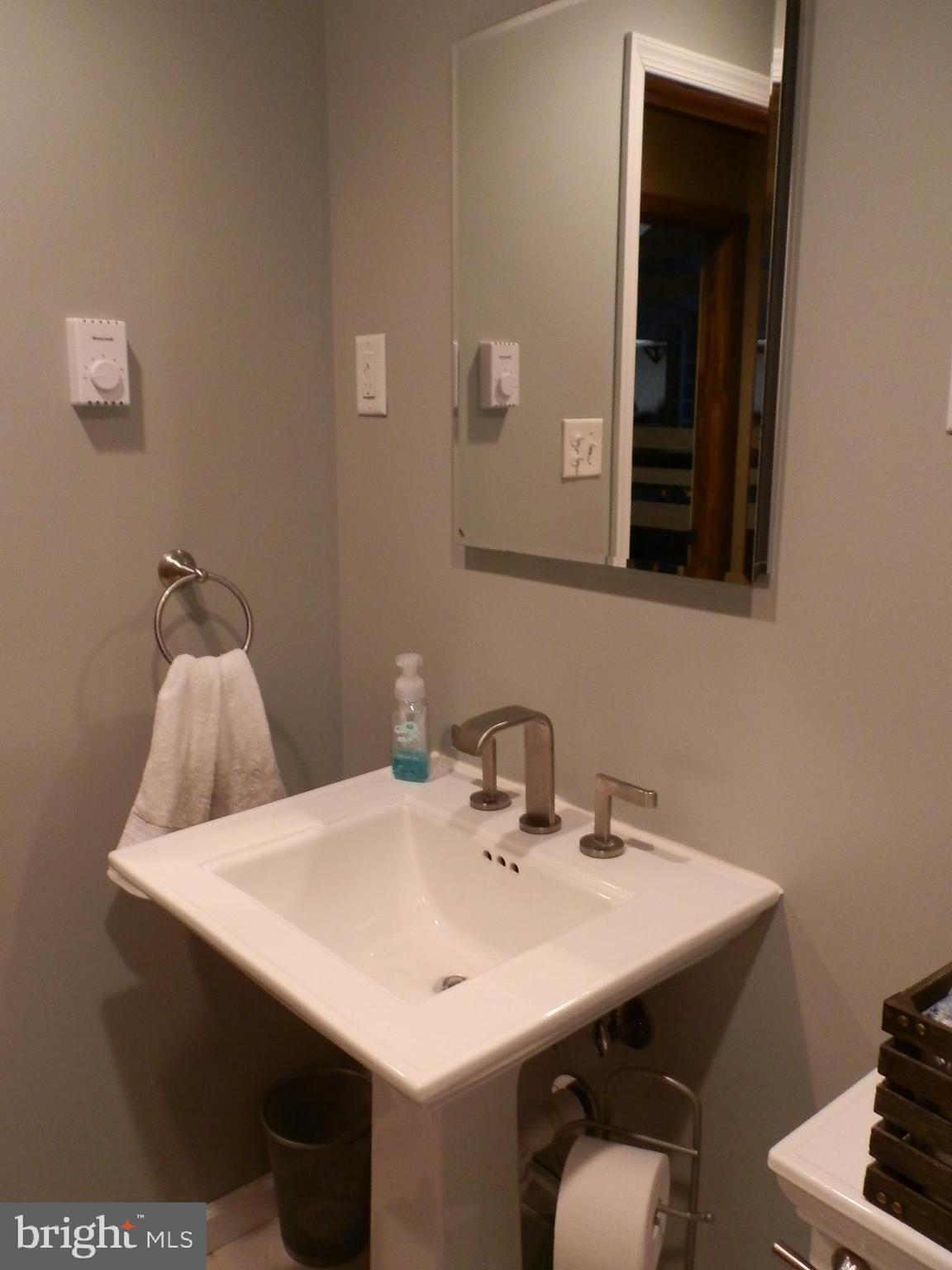 10 Georgia Road Pennsville, NJ 08070 - Photo 37 of 48 a bathroom with a sink and a mirror