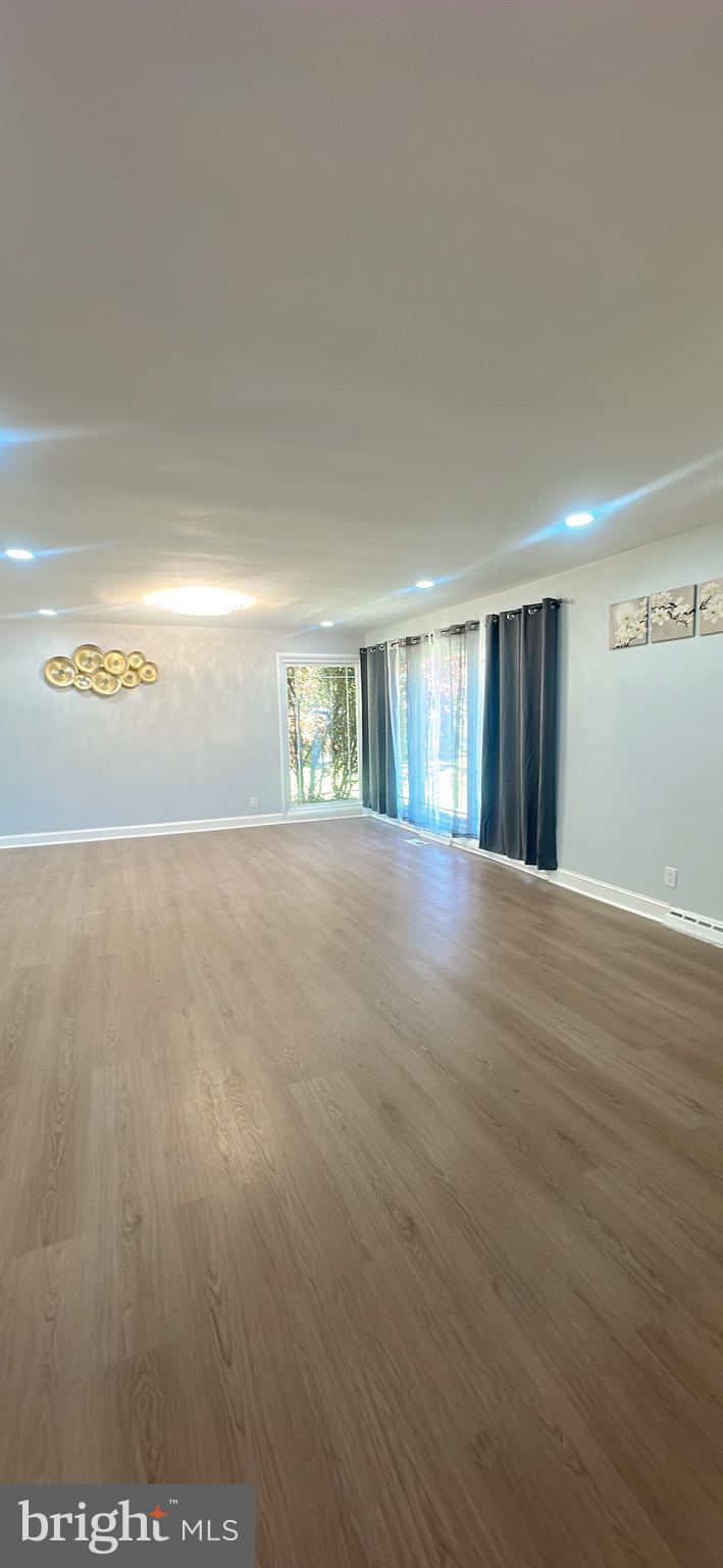 1242 June Road Huntingdon Valley, PA 19006 - Photo 12 of 47 a view of an empty room with wooden floor