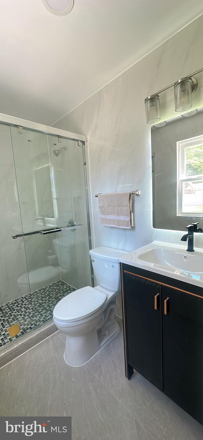 1242 June Road Huntingdon Valley, PA 19006 - Photo 31 of 47 a bathroom with a sink toilet and shower