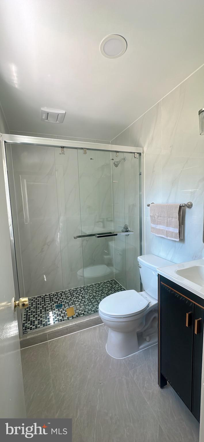 1242 June Road Huntingdon Valley, PA 19006 - Photo 33 of 47 a bathroom with a sink a toilet and shower