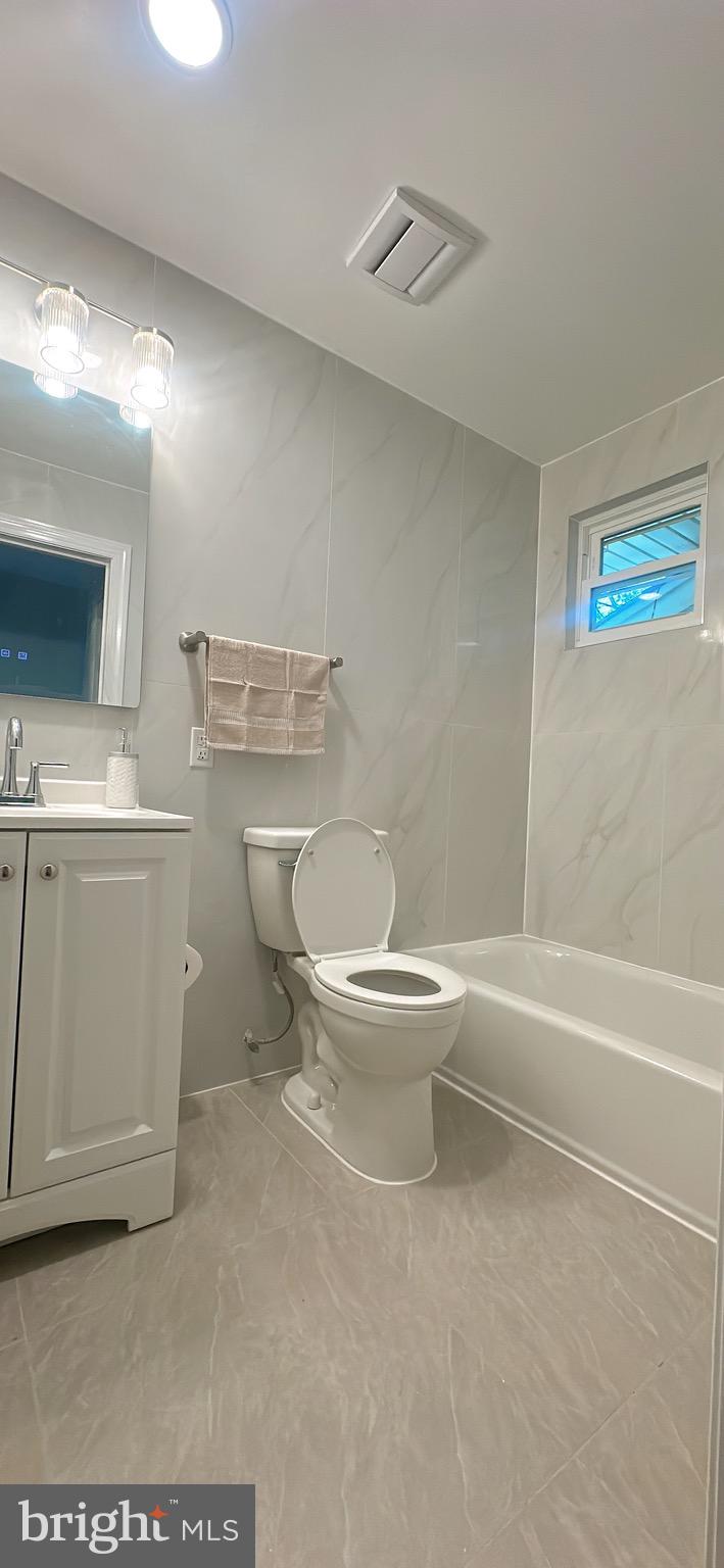 1242 June Road Huntingdon Valley, PA 19006 - Photo 40 of 47 a white toilet sitting next to a bathroom sink