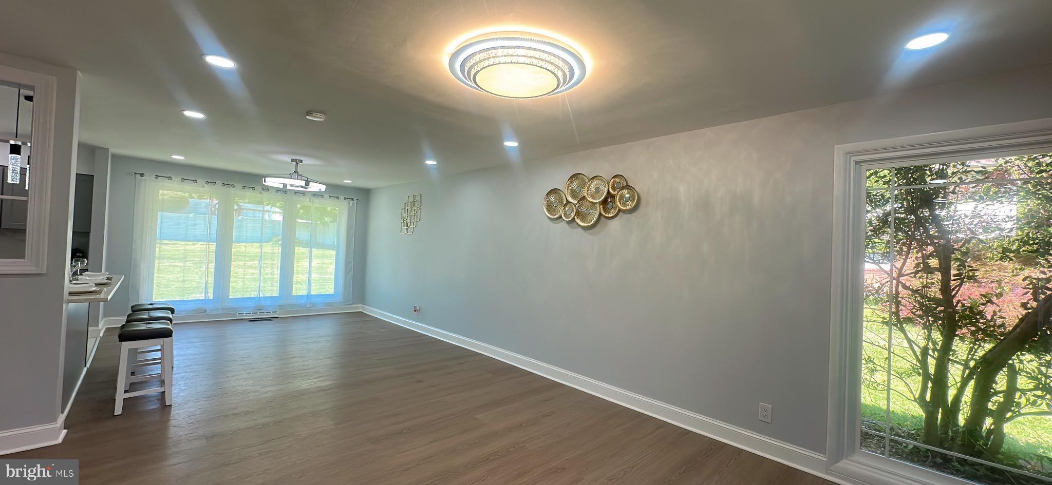 1242 June Road Huntingdon Valley, PA 19006 - Photo 41 of 47 an empty room with wooden floor and windows