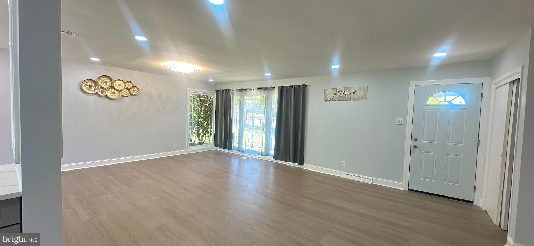 1242 June Road Huntingdon Valley, PA 19006 - Photo 42 of 47 an empty room with wooden floor and windows