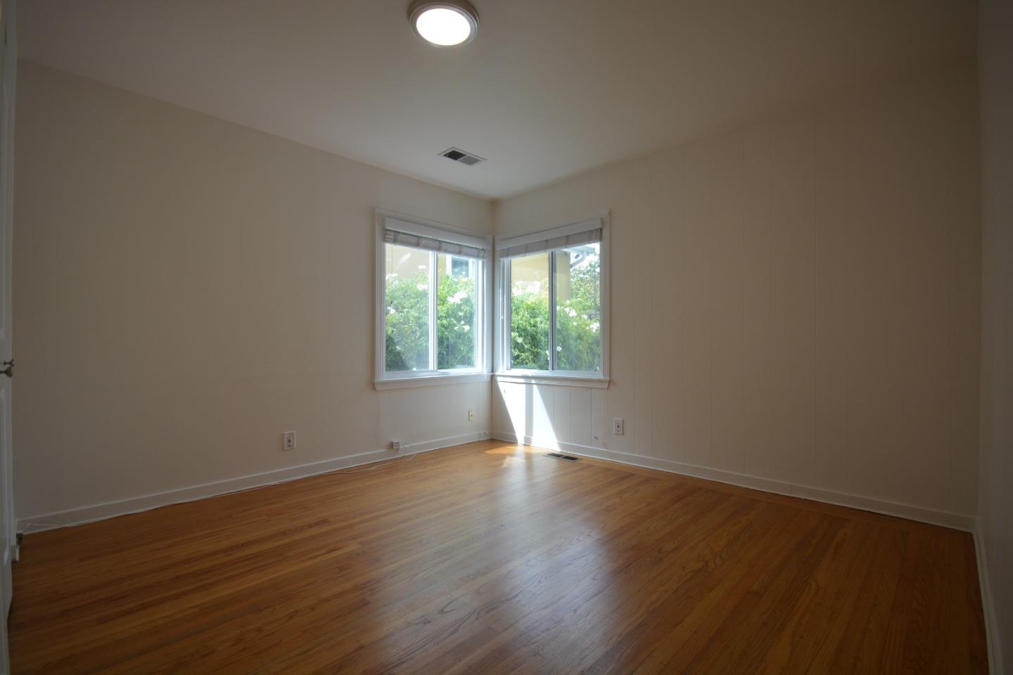 224 Park Boulevard Millbrae, CA 94030 - Photo 11 of 17 a view of an empty room with wooden floor and a window