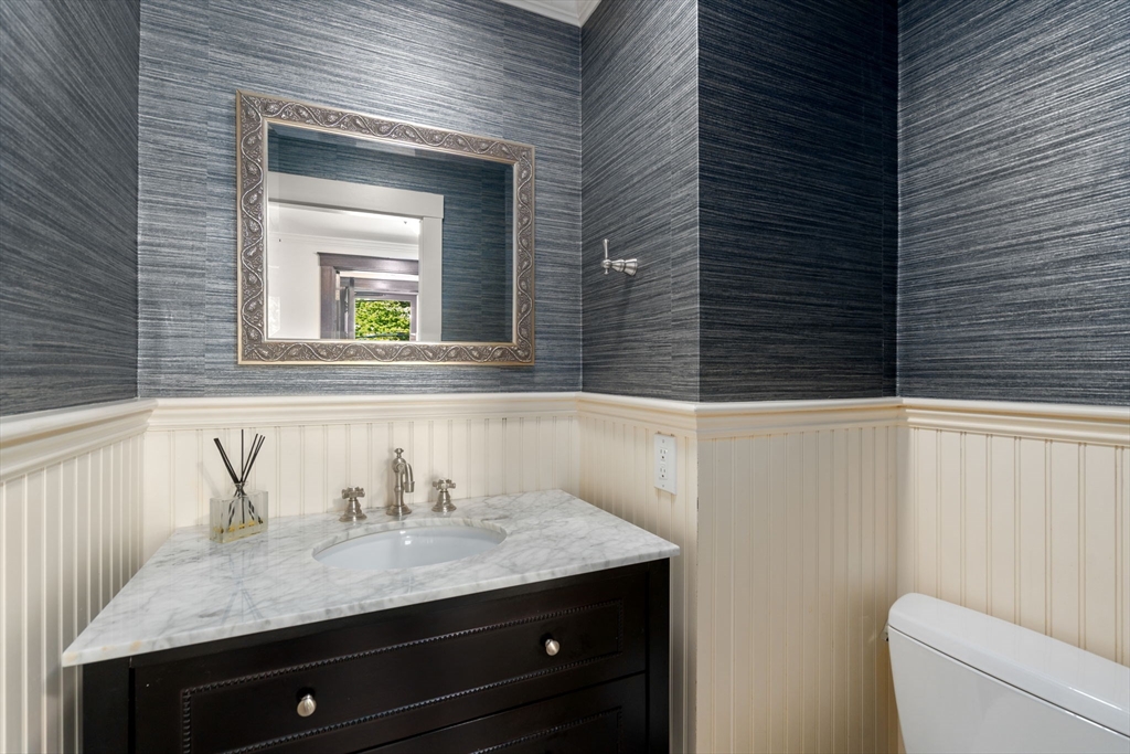39 Ingraham Road Wellesley, MA 02482 - Photo 12 of 30 a bathroom with a granite countertop sink and a toilet