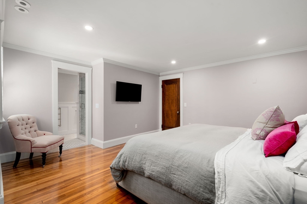 39 Ingraham Road Wellesley, MA 02482 - Photo 15 of 30 a bedroom with a bed and a television