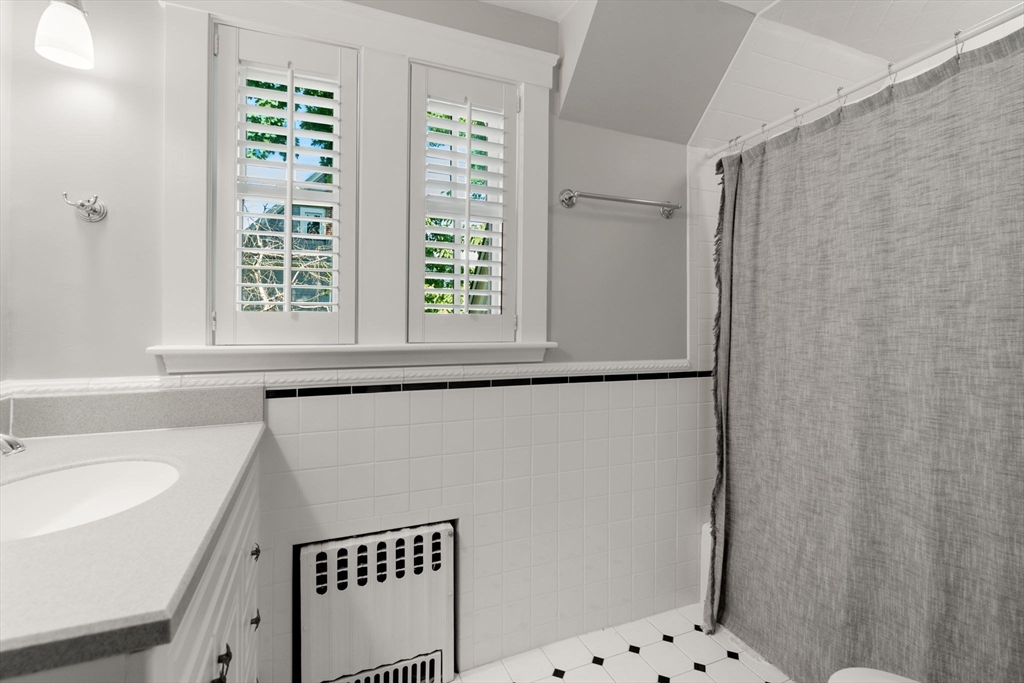 39 Ingraham Road Wellesley, MA 02482 - Photo 20 of 30 a bathroom with a sink and a shower