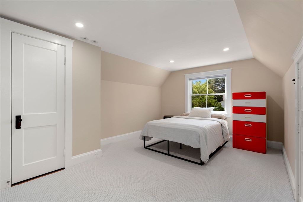 39 Ingraham Road Wellesley, MA 02482 - Photo 21 of 30 a spacious bedroom with a bed and a dresser