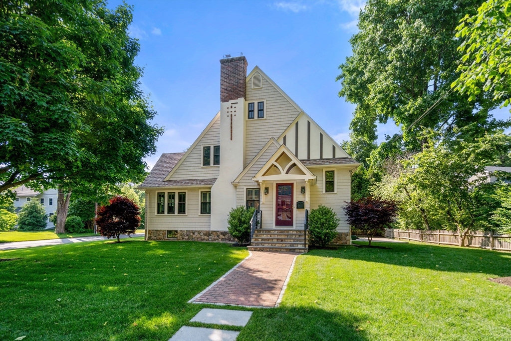39 Ingraham Road Wellesley, MA 02482 - Photo 29 of 30 a front view of a house with a garden and trees