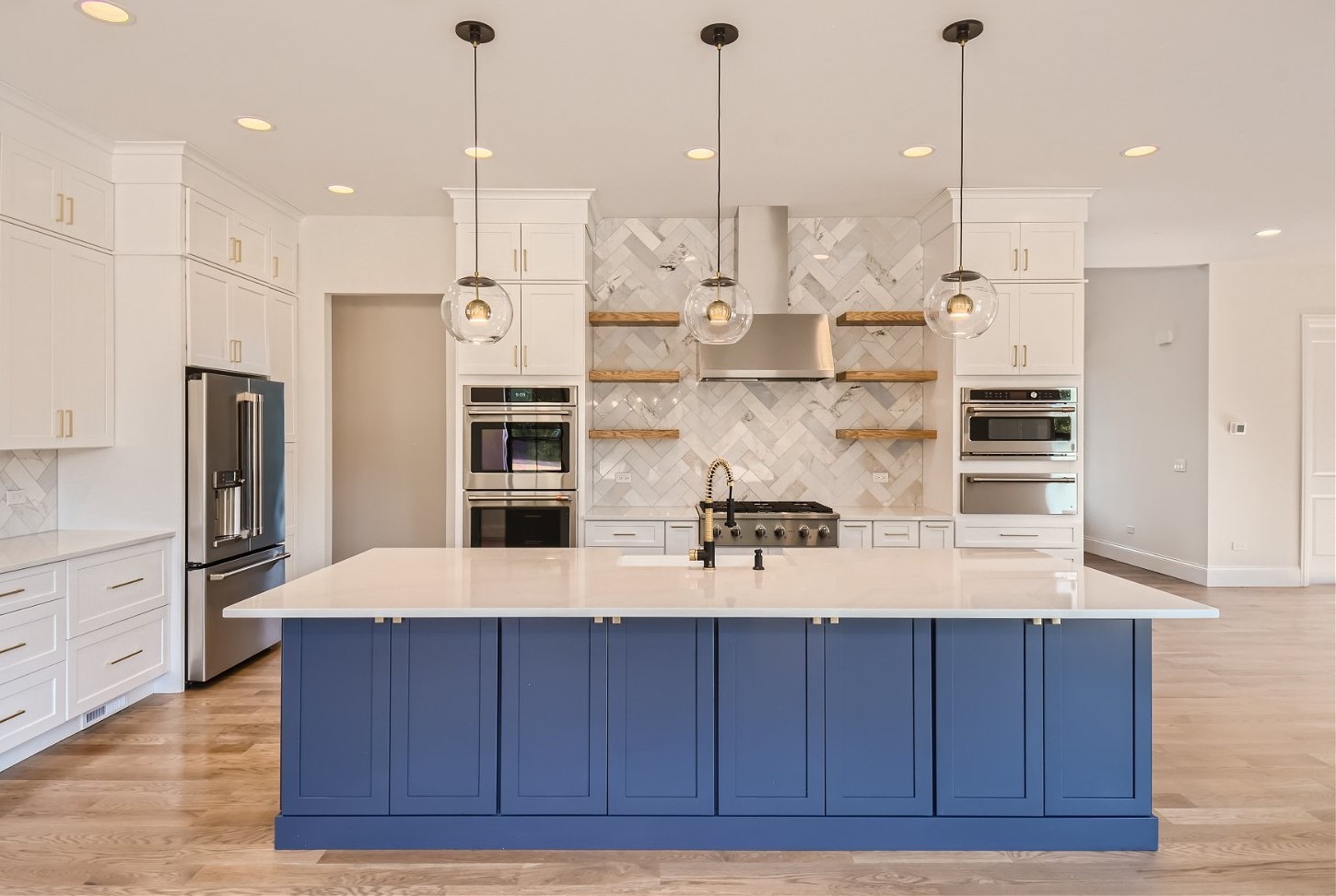 8 Alexandra Drive Mettawa, IL 60048 - Photo 12 of 30 a large kitchen with stainless steel appliances kitchen island granite countertop a refrigerator a oven and a wooden floors