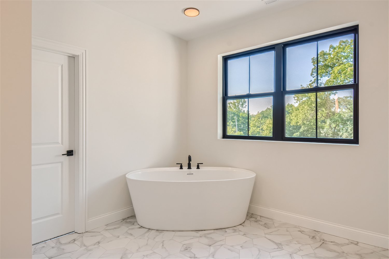 8 Alexandra Drive Mettawa, IL 60048 - Photo 19 of 30 a white bath tub sitting next to a window