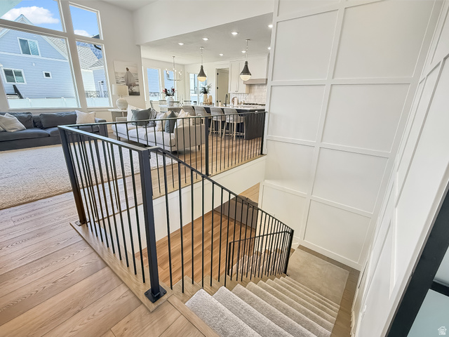 916 Rocky Mountain Way Elk Ridge, UT 84651 - Photo 36 of 54 Stairway with recessed lighting and wood finished floors
