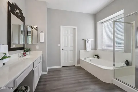 a bathroom with a sink double vanity and a mirror