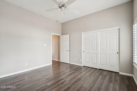 a spacious bathroom with a tub sink and mirror