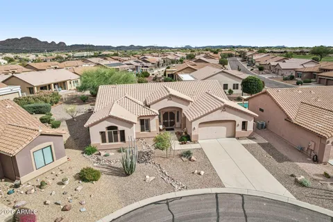 an aerial view of a house with a terrace