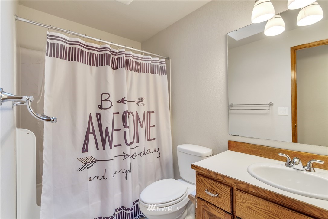 20619 Filbert Drive Bothell, WA 98012 - Photo 22 of 30 a bathroom with a sink a toilet and a mirror