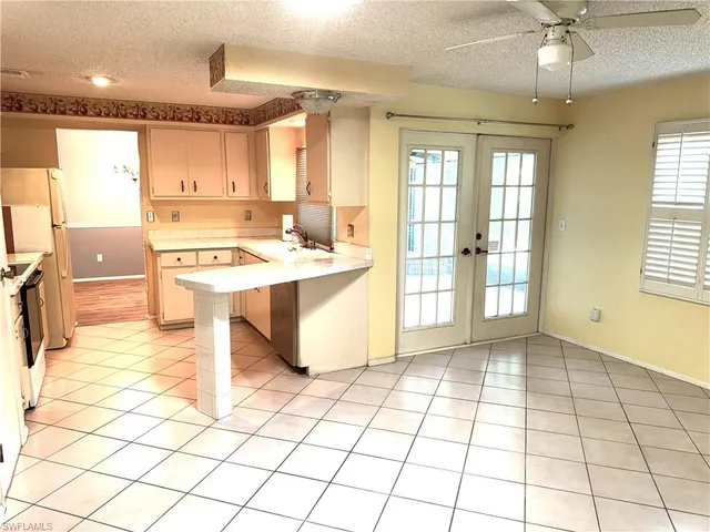 a view of a kitchen with furniture and a window