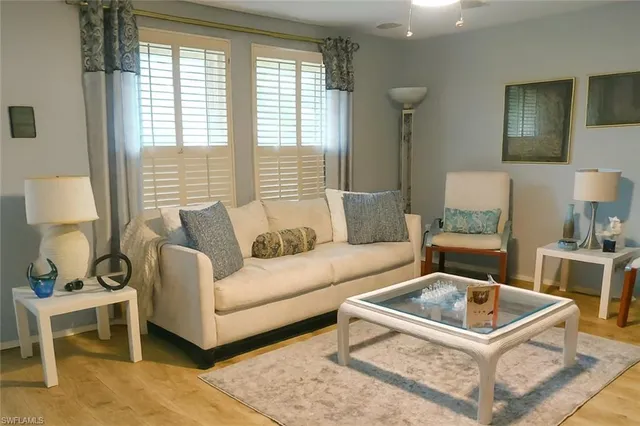 a living room with furniture and a table