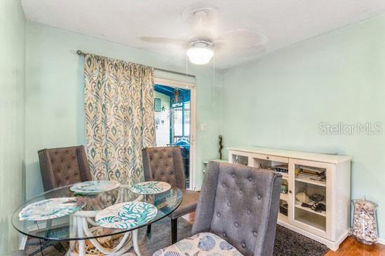 4544 Cynthia Lane Spring Hill, FL 34606 - Photo 11 of 35 a living room with furniture and wooden floor