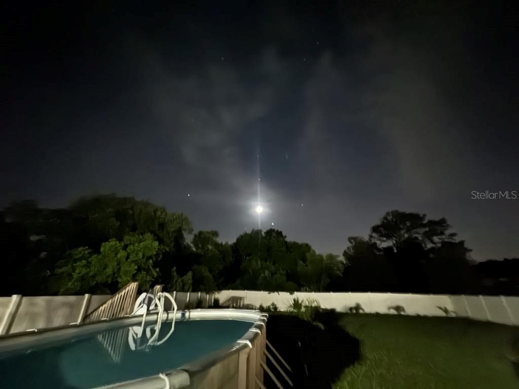 4544 Cynthia Lane Spring Hill, FL 34606 - Photo 32 of 35 a view of swimming pool and outdoor seating