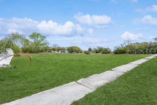 4544 Cynthia Lane Spring Hill, FL 34606 - Photo 4 of 35 a view of a grassy field