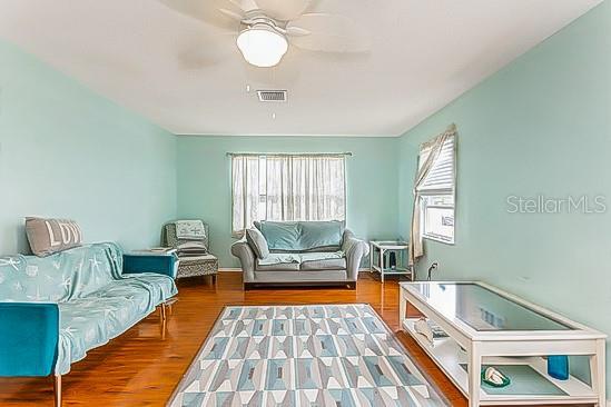 4544 Cynthia Lane Spring Hill, FL 34606 - Photo 6 of 35 a living room with furniture and a rug