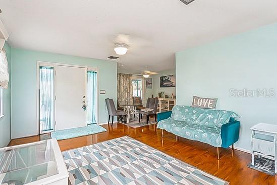 4544 Cynthia Lane Spring Hill, FL 34606 - Photo 9 of 35 a living room with furniture and a rug