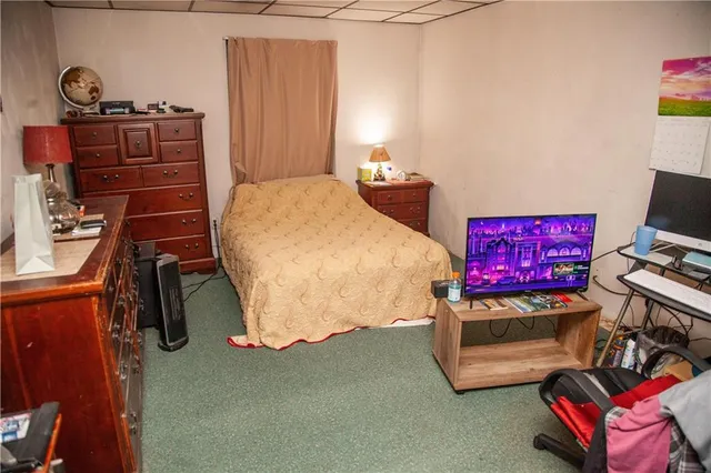 a bedroom with a bed and furniture