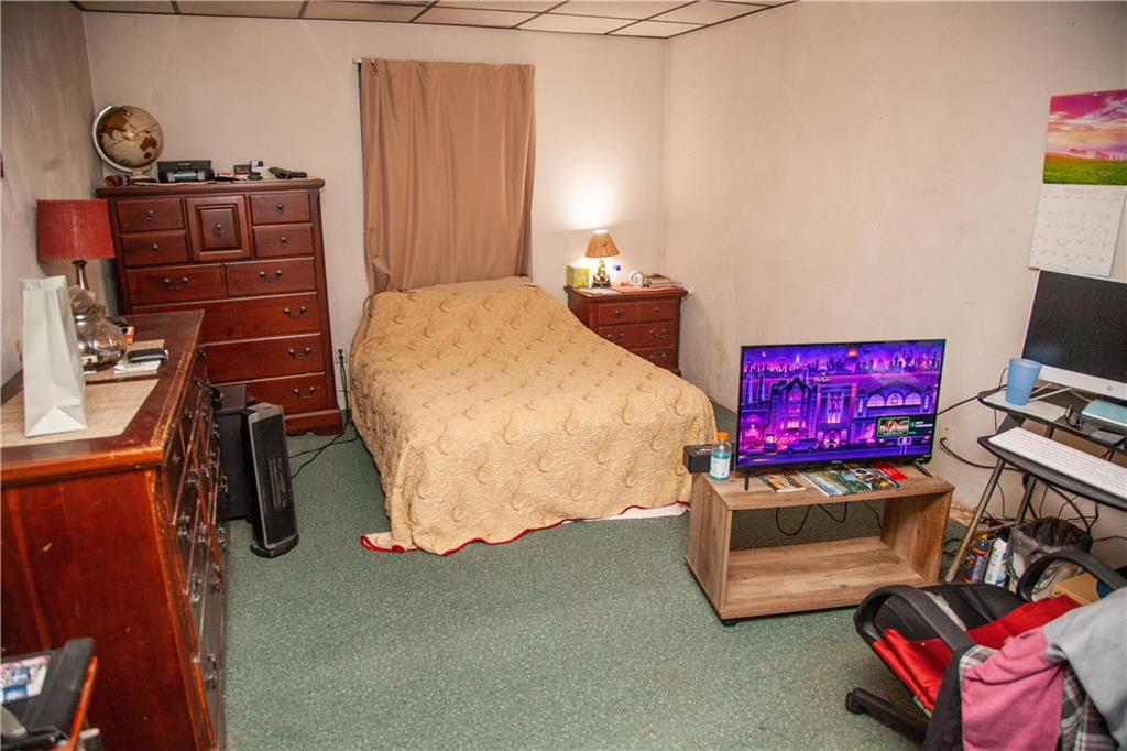 107 Madison Road Grindstone, PA 15442 - Photo 9 of 14 a bedroom with a bed and furniture