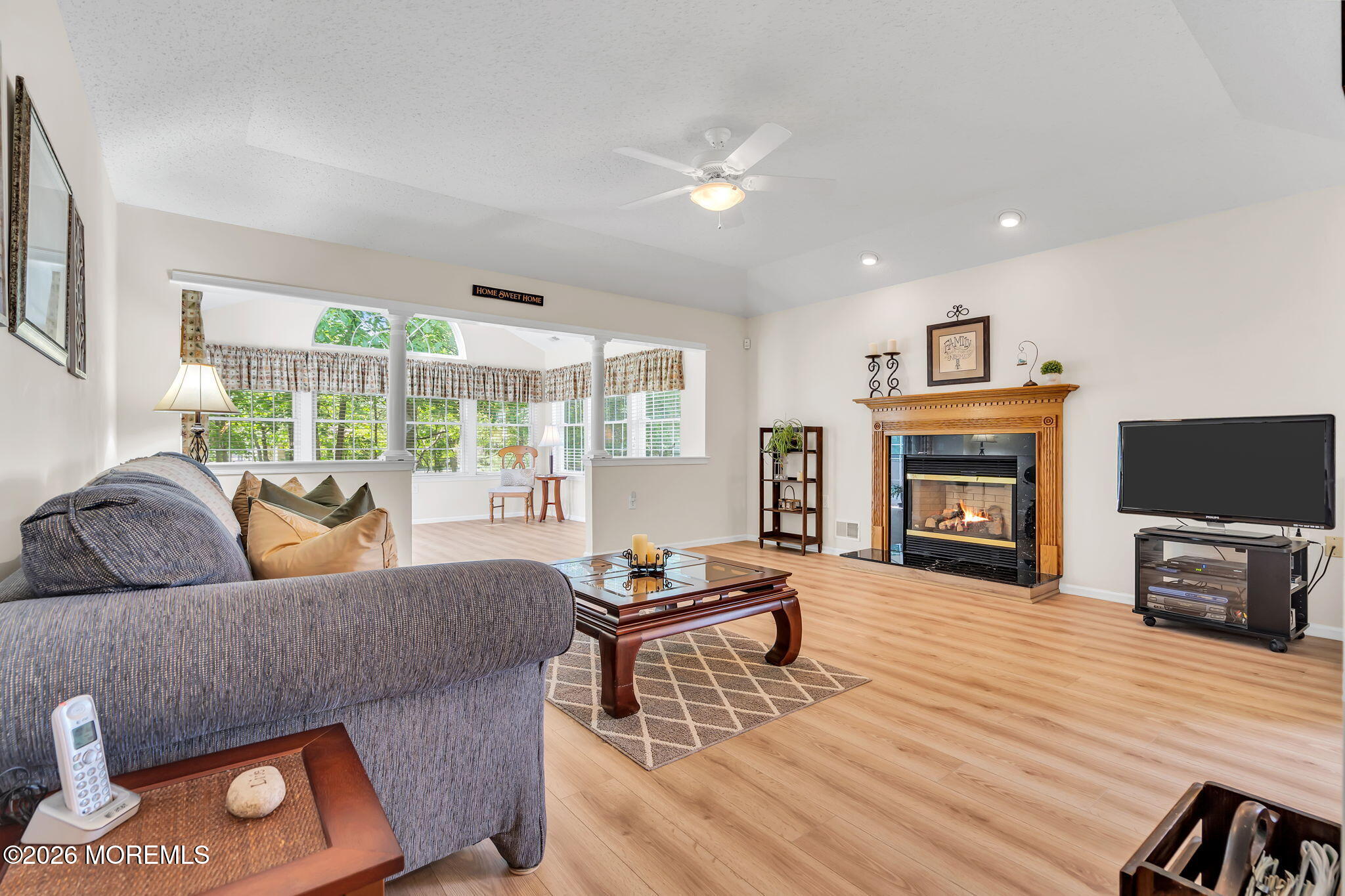 10 Congressional Road Jackson, NJ 08527 - Photo 26 of 72 a living room with furniture and a fireplace