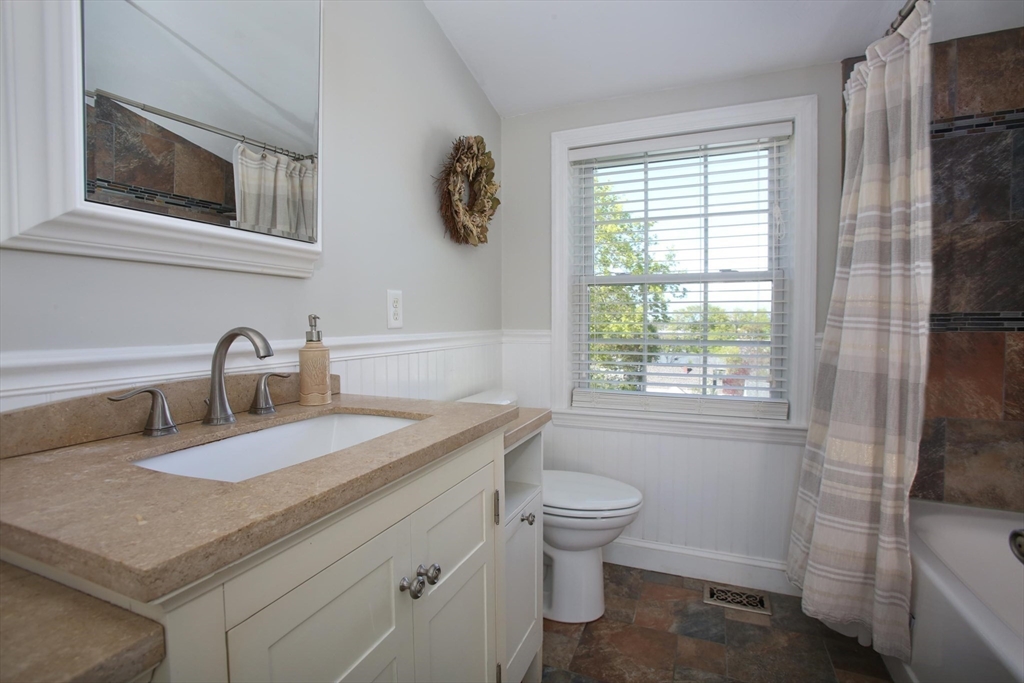 44 Brae Road Weymouth, MA 02191 - Photo 15 of 24 a bathroom with a sink a toilet and a window