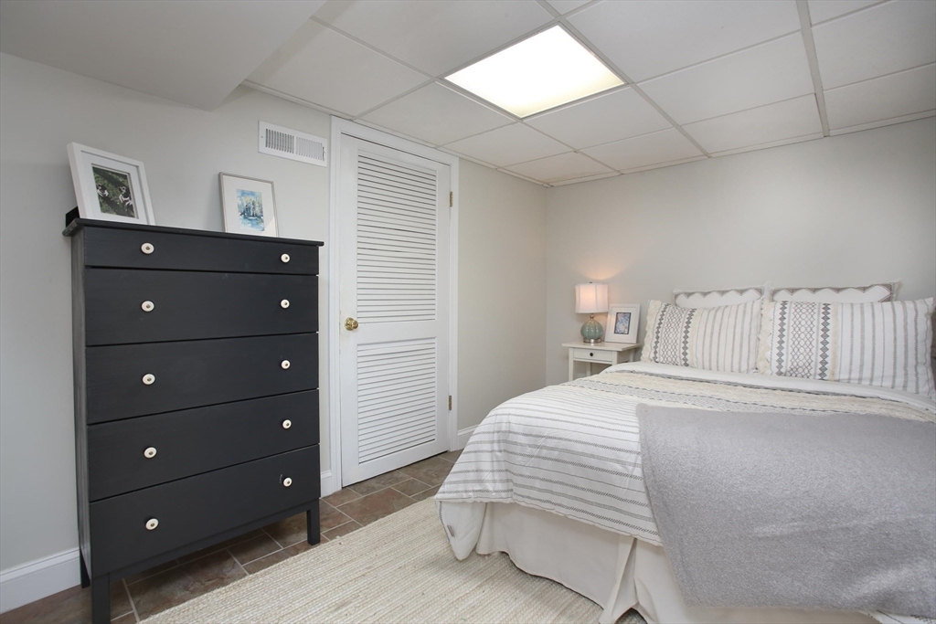 44 Brae Road Weymouth, MA 02191 - Photo 20 of 24 a bedroom with a bed and a dresser