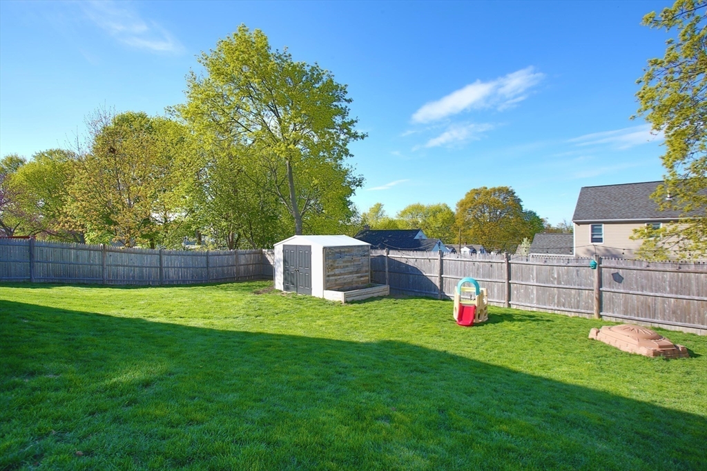 44 Brae Road Weymouth, MA 02191 - Photo 24 of 24 a view of a house with a backyard and a fence