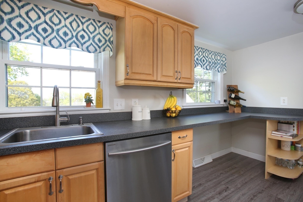 44 Brae Road Weymouth, MA 02191 - Photo 4 of 24 a kitchen with granite countertop a sink cabinets and window