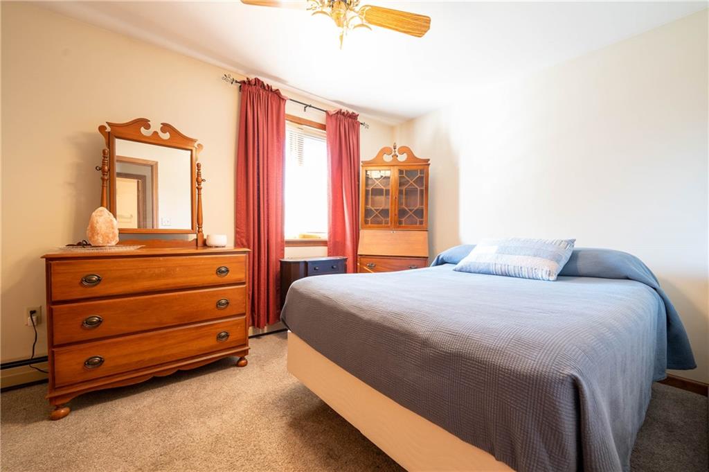 287 Ruffsdale Road Ruffs Dale, PA 15679 - Photo 12 of 21 a bedroom with a bed and a dresser