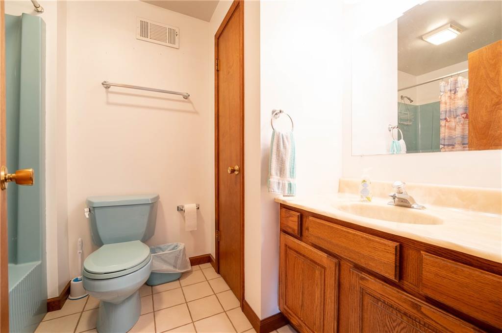 287 Ruffsdale Road Ruffs Dale, PA 15679 - Photo 13 of 21 a bathroom with a toilet a sink and mirror