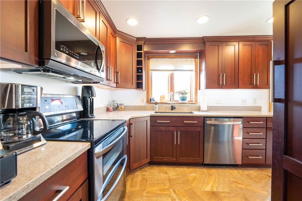 287 Ruffsdale Road Ruffs Dale, PA 15679 - Photo 7 of 21 a kitchen with stainless steel appliances granite countertop a sink stove and cabinets