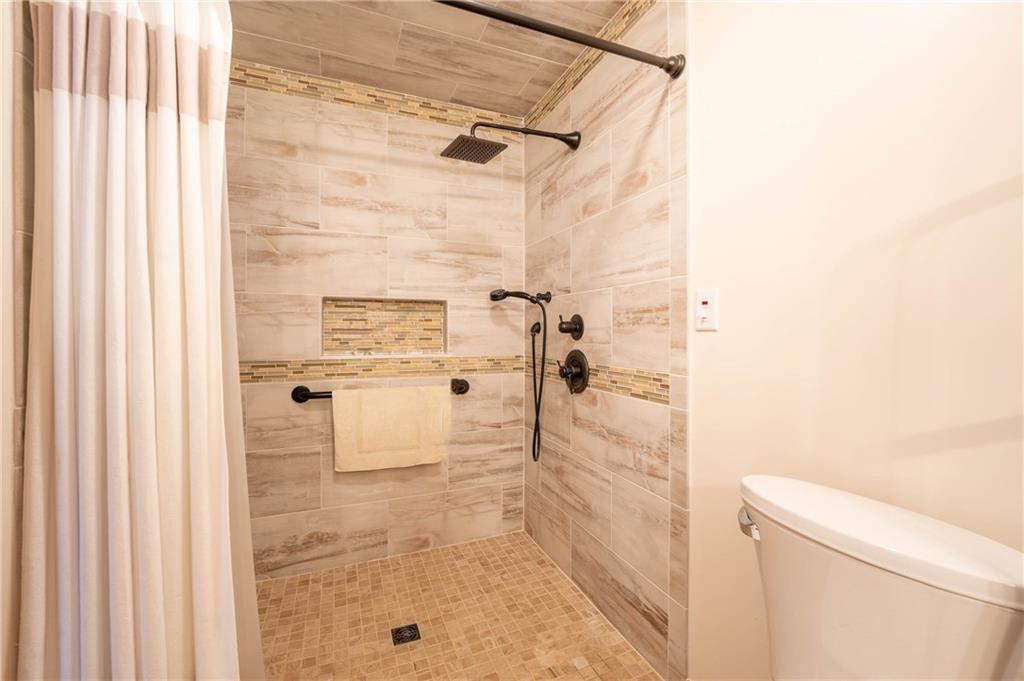 287 Ruffsdale Road Ruffs Dale, PA 15679 - Photo 9 of 21 a bathroom with a shower and a toilet