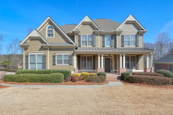 front view of a house with a yard