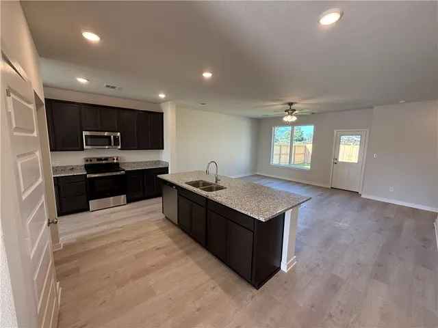 a bathroom with a double vanity sink and mirror