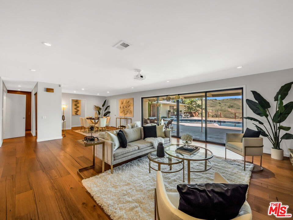 26077 Farmfield Road Calabasas, CA 91302 - Photo 1 of 45 a living room with furniture and a large window