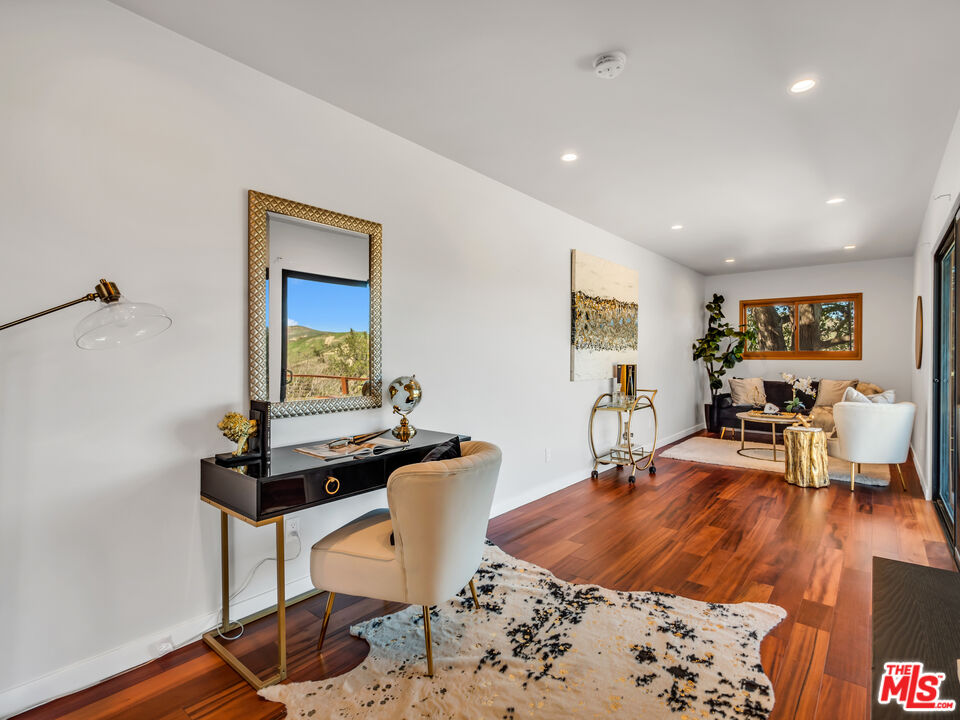 26077 Farmfield Road Calabasas, CA 91302 - Photo 41 of 45 a living room with a couch and a table