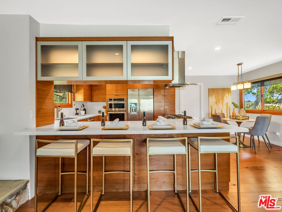 26077 Farmfield Road Calabasas, CA 91302 - Photo 7 of 45 a dining table with chairs and window