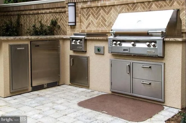 a kitchen with a stove and a refrigerator