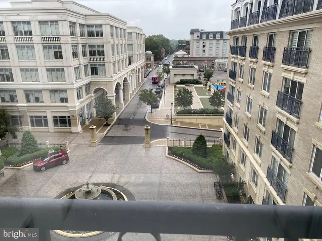 a front view of a building with parking area