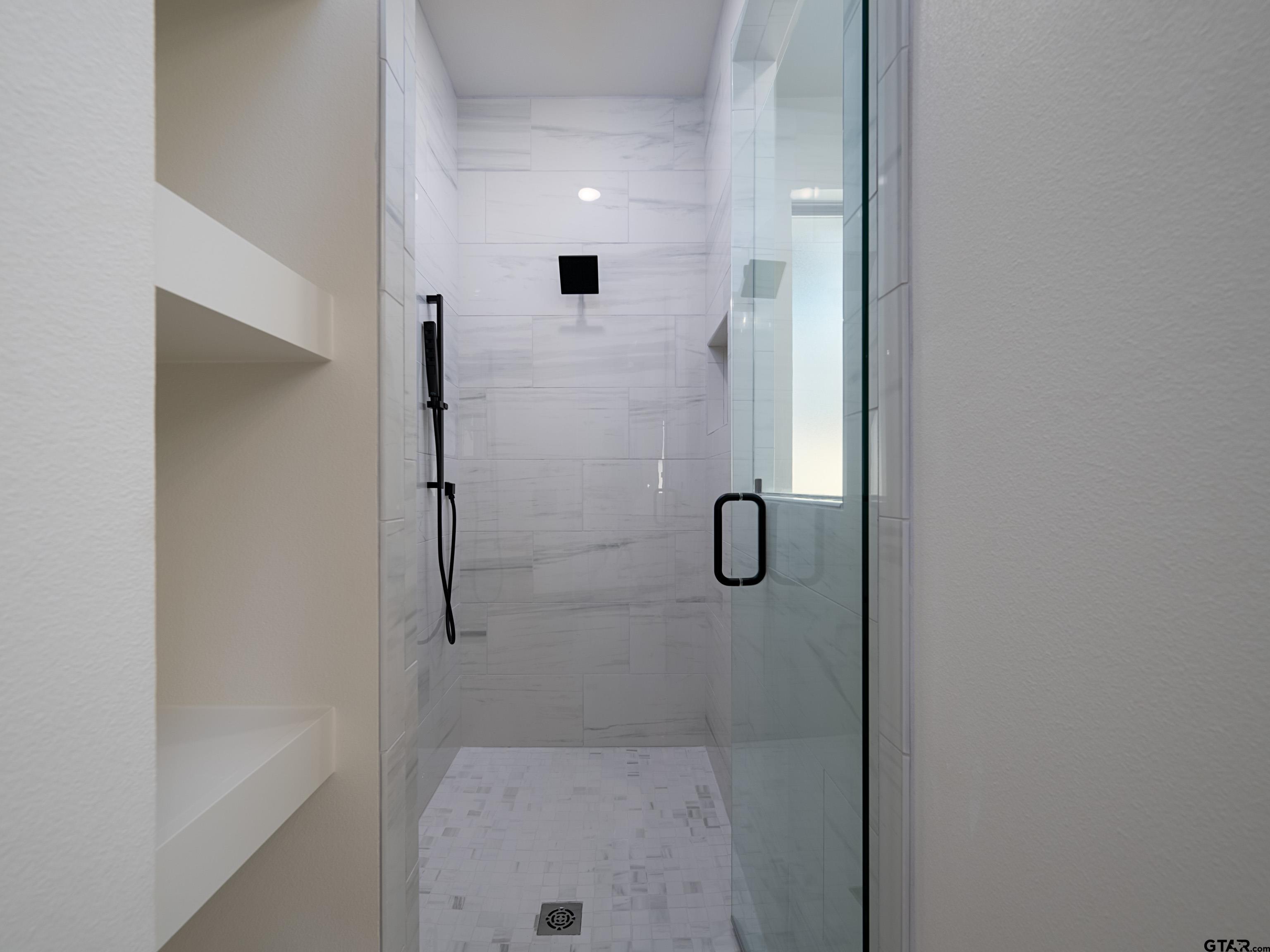 5216 Hollytree Drive Tyler, TX 75703 - Photo 18 of 28 a bathroom with a shower
