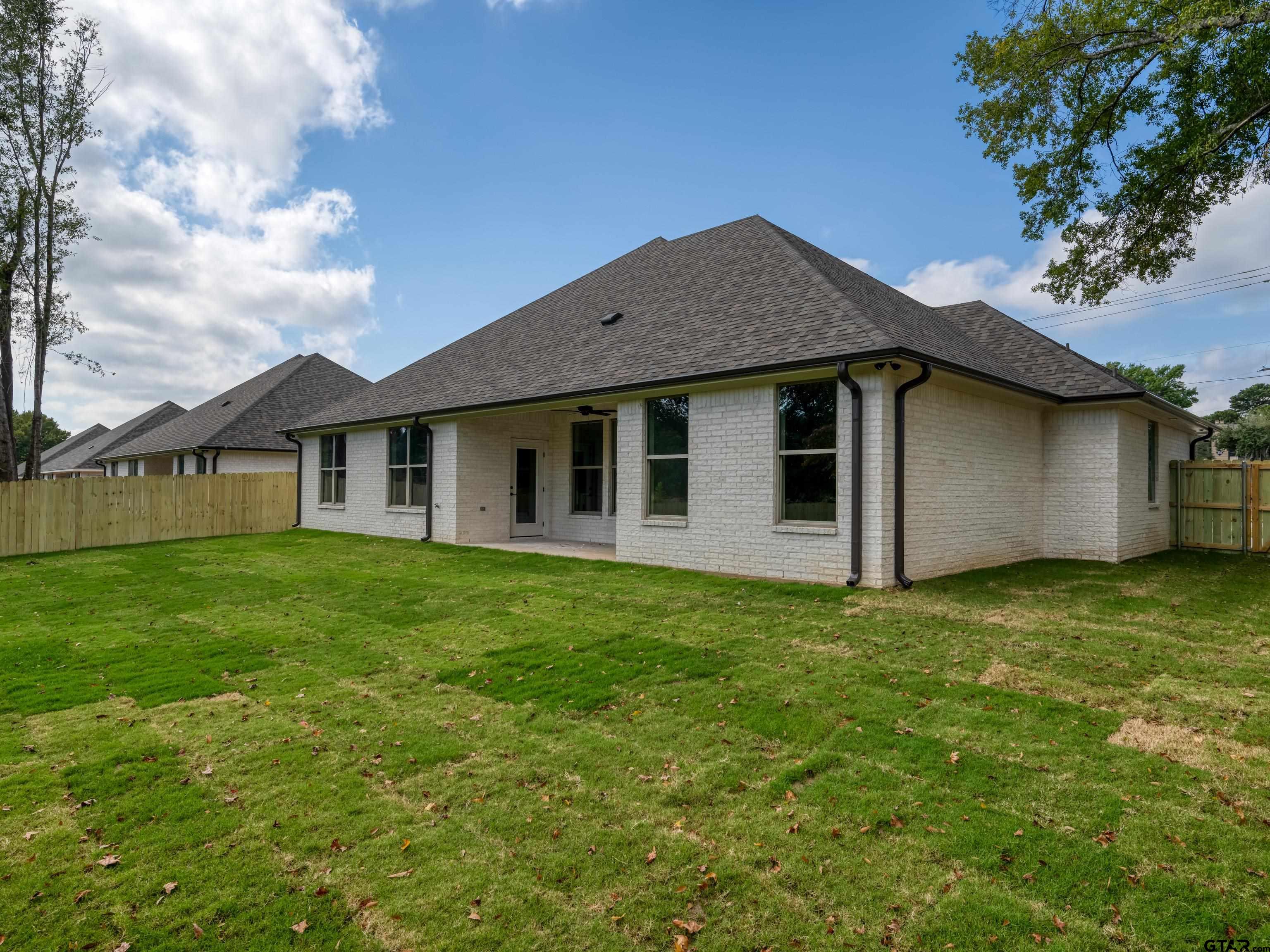 5216 Hollytree Drive Tyler, TX 75703 - Photo 27 of 28 a view of a house with a backyard